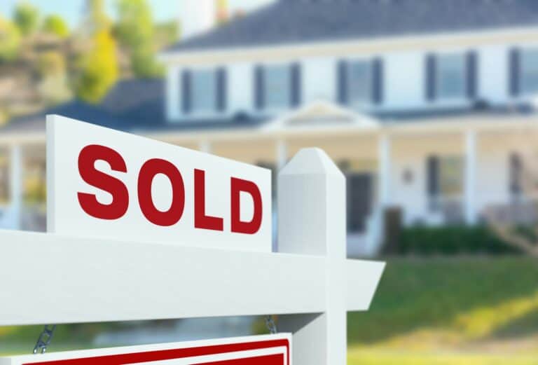 house with sold sign